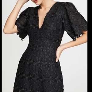Dress by La Maison Talulah. Limousine mini lace dress with sleeves.